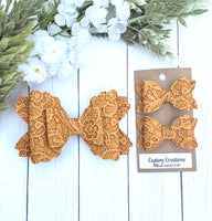 Mustard Embossed Bows